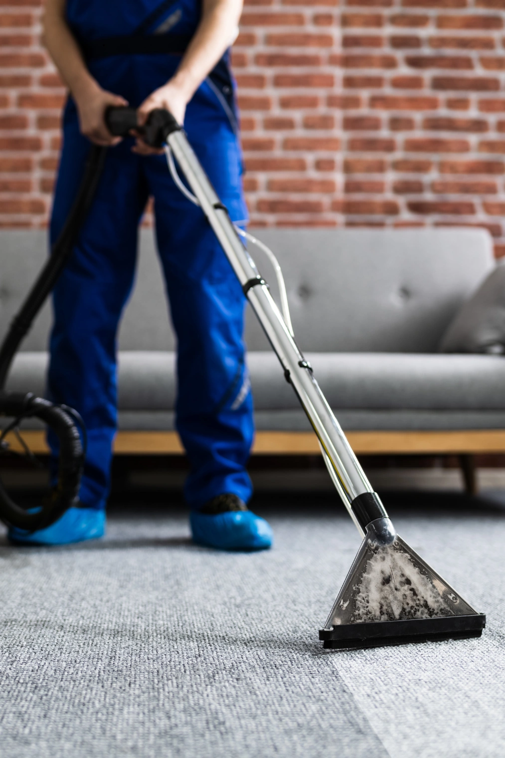 Carpet cleaning service section a cleaner working in blue